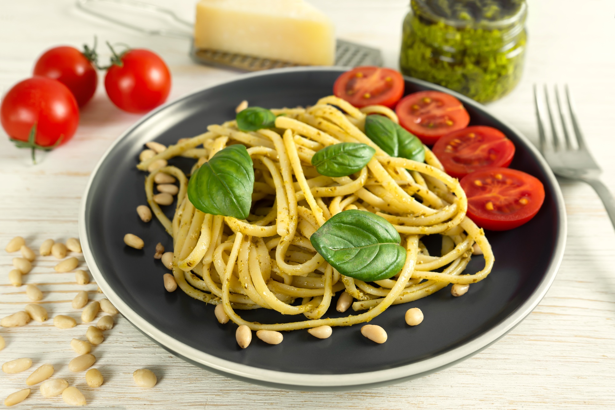 Pasta with fresh homemade pesto sauce and food ingredients